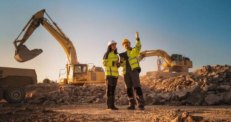 Development professionals reviewing a construction site together